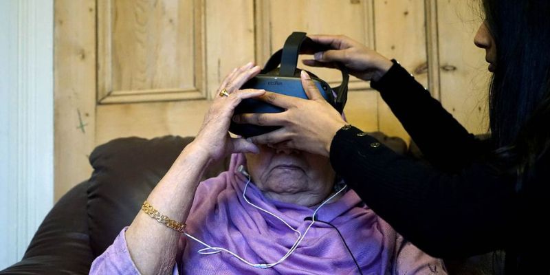 A survivor of Indias Partition looks through a virtual reality headset at footage made by Project Dastaan, a non-profit that seeks to connect witnesses of the 1947 Partition to their ancestral homes and villages. Picture courtesy: Project Dastaan/Thomson Reuters Foundation