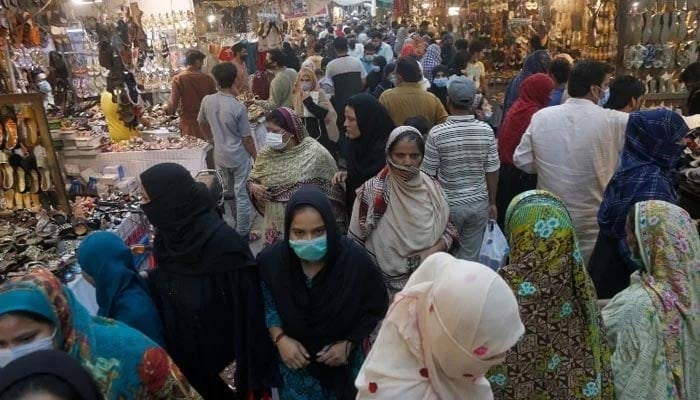 People can be seen shopping in a local market in Lahore on April 28, 2021. — APP/File