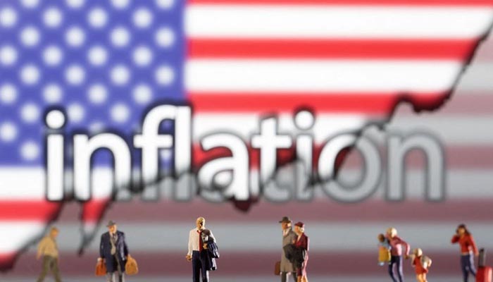 Small figurines are seen in front of the displayed word Inflation, a US flag and a rising stock graph in this illustration taken February 11, 2022. — Reuters/File