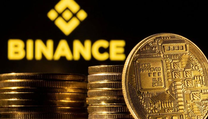 A representation of cryptocurrency is seen in front of Binance logo in this illustration taken, March 4, 2022. Photo: REUTERS