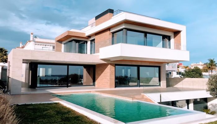 A house with a pool outside. Photo: Unsplash