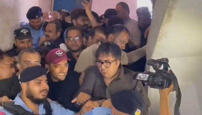 Screengrab of a video showing PTI leader Shahbaz Gill being taken to the courtroom during todays hearing. — Twitter