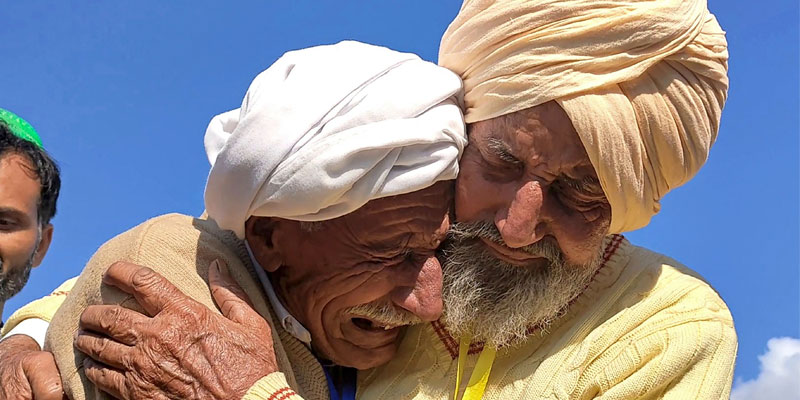 In this picture Indian Sikh labourer Sika Khan meets his brother Sadiq Khan at Kartarpur Corridor. — AFP