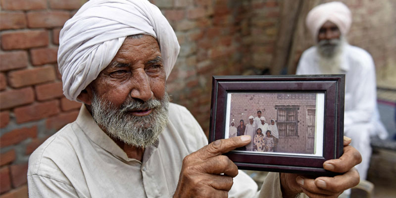 In this picture taken on August 2, 2022, Indian Sikh labourer Sika Khan shows his elder brother Sadiq. — AFP