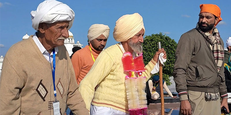 The two brothers walk with hands in hands at Kartarpur Corridor. — AFP