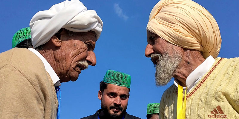 In this picture Indian Sikh labourer Sika Khan meets his brother Sadiq Khan at Kartarpur Corridor. — AFP