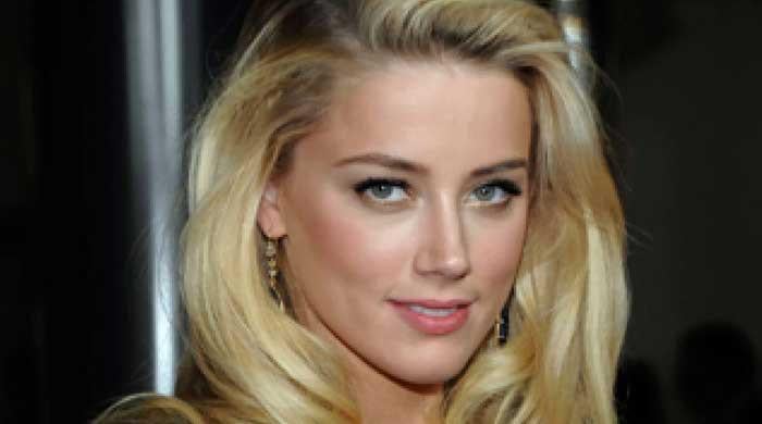 Amber Heard wins hearts as she displays her true smile and beauty for first time since Johnny Depp's case