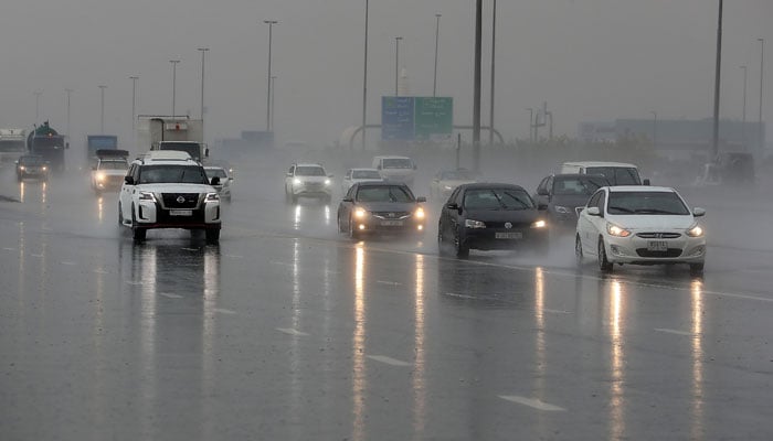 Motorists drive in the rain on Al Khail Road in Dubai on Jan 3. — The National