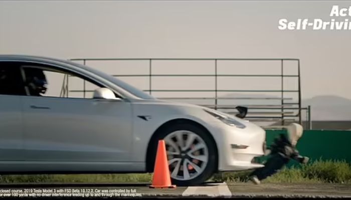 Tesla runs over child mannequin.— Screengrab via YouTube