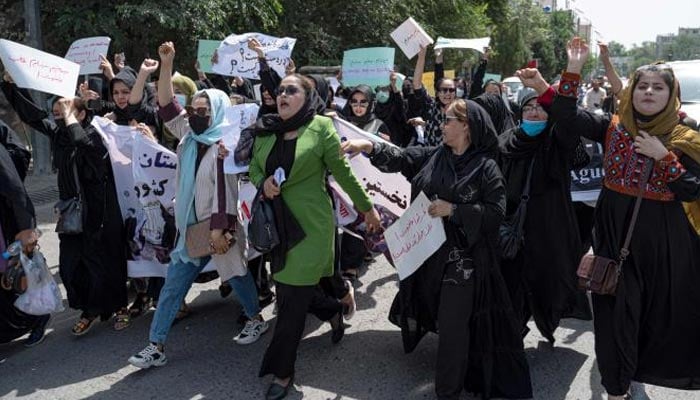 Afghan women shout Bread, work, freedom during a womens rights protest in Kabul on August 13, 2022. — AFP