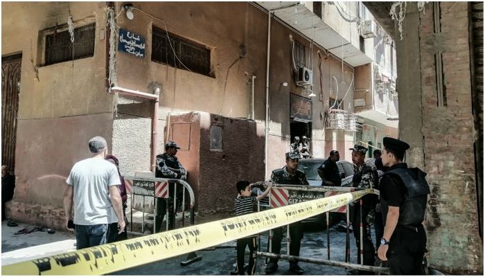 Security personnel standing outside the Church building where the fire took place on August 14, 2022. — Reuters