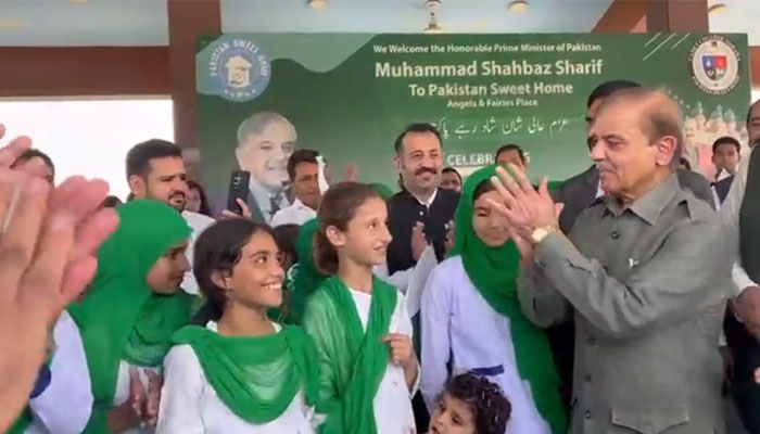 Prime Minister Shehbaz Sharif lauds a kid at the Pakistan Sweet Home. — Screengrab via Twitter