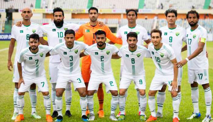 Pakistani football team players pose for a photo before a match. — Reporter