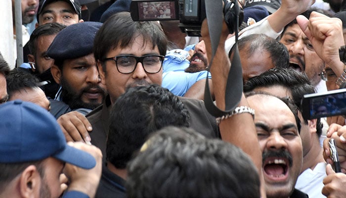 PTI leader Shahbaz Gill arriving in police custody for a hearing at an Islamabad district and sessions court on Friday in the federal capital.— Online