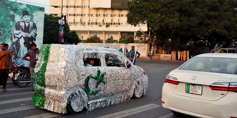 A car is entirely covered with green and white chamak patti— PPI