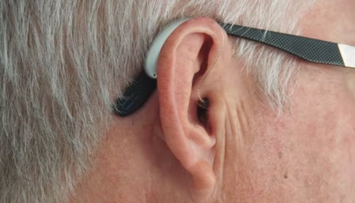 Person wearing hearing aid. — Unsplash