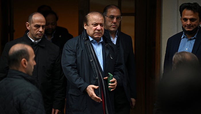 Former prime minister Nawaz Sharif (3L), brother of Pakistans current Prime Minister Shehbaz Sharif, leaves property in west London on May 11, 2022. — AFP