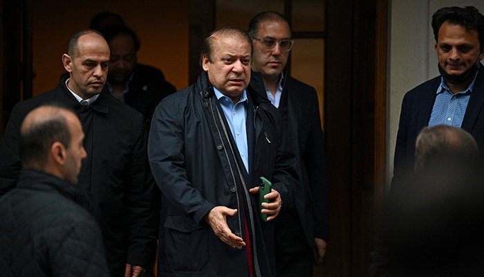 Former prime minister Nawaz Sharif (3L), brother of Pakistans current Prime Minister Shehbaz Sharif, leaves property in west London on May 11, 2022. — AFP