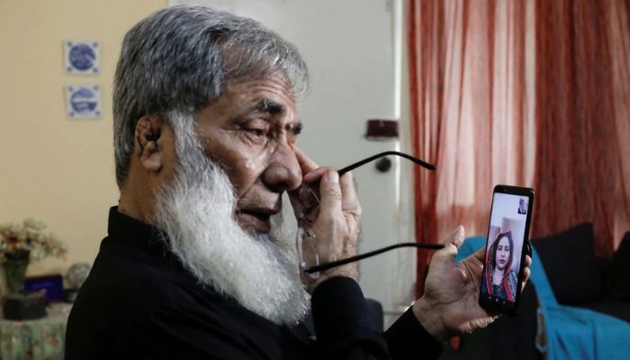Ali Hasan Baqai, 76, whose family was divided by the partition of the subcontinent in 1947, weeps while speaking on a video call with his Indian citizen sister Shehla, 45, who lives in Delhi, India, at home in Karachi, Pakistan August 12, 2022. — Reuters