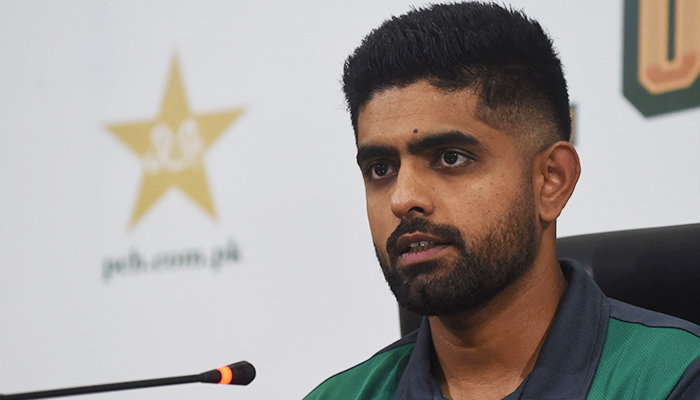 Pakistans cricket captain Babar Azam speaks during a press conference in Lahore on August 11, 2022. — AFP