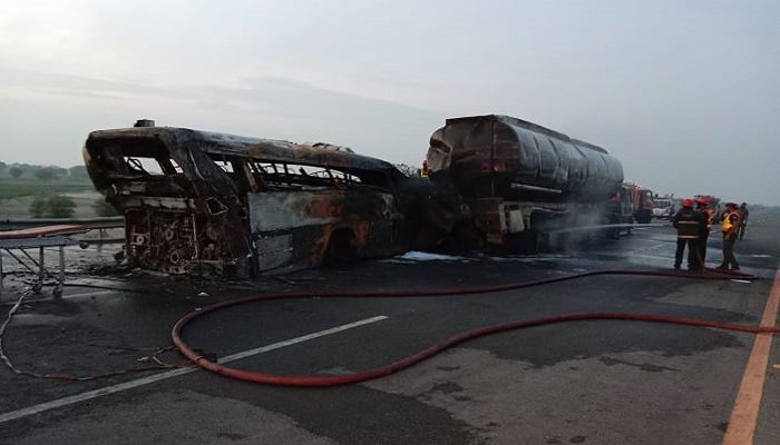 Charred wreckage seen in picture after an oil tanker and bus caught fire soon following a collision on the M-5 Motorway. Photo: @DeputyMultan/ Twitter