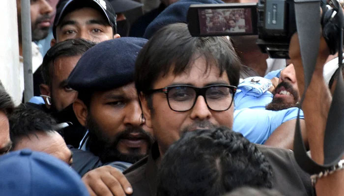 PTI leader Shahbaz Gill arriving in police custody for a hearing at an Islamabad district and sessions court on Friday in the federal capital.— Online/File