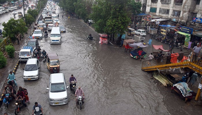 A Karachi road seen submerged under rainwater on July 8. Photo: INP