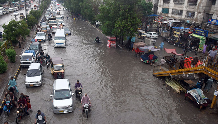 A Karachi road seen submerged under rainwater on July 8. Photo: INP