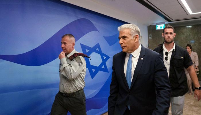 Israels Prime Minister Yair Lapid walks as he attends the weekly cabinet meeting in Jerusalem, August 14, 2022. — Reuters/File