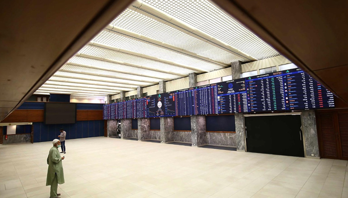 An investor can be seen standing in the main hall of the Pakistan Stock Exchange (PSX). — INP/File