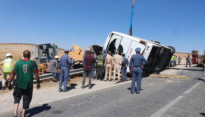 Rescuers and security forces gather at the scene of a bus crash on a motorway in Khouribga province, east of Morocco’s economic capital Casablanca, on August 17, 2022. – The crash left 23 people dead, a health official said, marking one of the deadliest such accidents in recent years. Photo: AFP