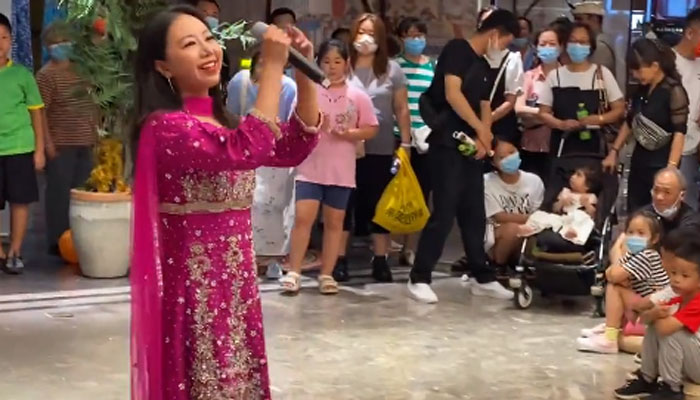 Music teacher at the Pakistan Embassy College Beijing Vicky performing song. — Screengrab