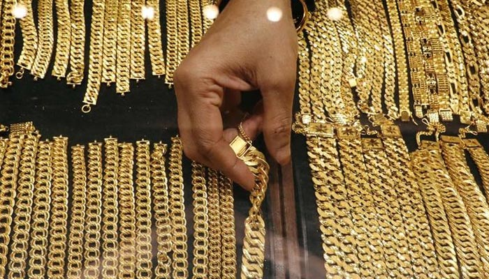 A vendor arranges gold chains displayed at VJ Gold and Diamond jewellery shop in Kuala Lumpur, Malaysia August 10, 2020. — Reuters/File