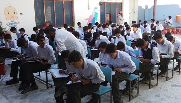 Students sit for a final exam. — AFP/ File