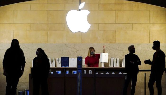 Apple employees work in an Apple Store at the Grand Central Terminal in the Manhattan borough of New York City, New York, U.S., January 4, 2022. — Reuters