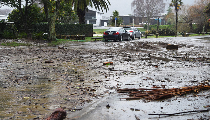 Debris is seen left strewn on a street in Nelson on August 18, 2022, after the city experienced flash floods caused by a storm. Hundreds of families on New Zealands South Island were forced to leave their homes on August 18 after flooding caused a state of emergency to be declared in three regions. — AFP