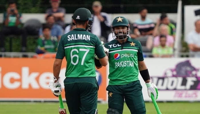 Pakistans Salman Ali Agha (left) and Mohammad Rizwan celebrate after winning against the Netherlands in Rotterdam, on August 18, 2022. — PCB