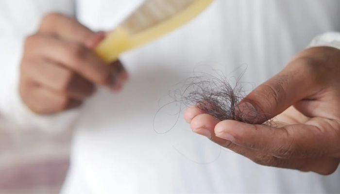 Close Up Photo of a Person Holding Hair. — Pexel