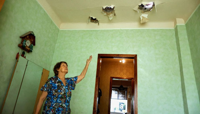 72-year-old Ukrainian Valentyna Danylivna shows the damage inside her house after a night shelling, as Russias attack in Ukraine continues, in Bakhmut, Donetsk region, Ukraine August 21, 2022. — Reuters