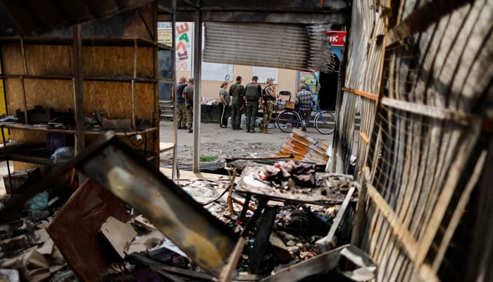 Ukrainian military officers and civilians shop at a street market, as Russias attack in Ukraine continues, in Bakhmut, Donetsk region, Ukraine August 21, 2022. — Reuters