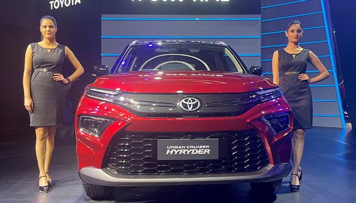 Models pose at the unveiling of Toyotas new hybrid SUV Urban Cruiser Hyryder in New Delhi, India, July 1, 2022. — Reuters