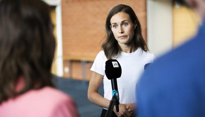 Finlands Prime Minister Sanna Marin speaks with members of the media in Kuopio, Finland, on August 18, 2022. — Reuters/File