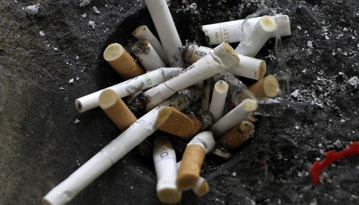 Cigarette butts in an ashtray in Los Angeles, California, May 31, 2012. — Reuters