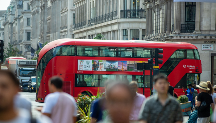 A red bus with the banner of the campaign regarding Pakistans 75th Independence Day in London. — Photo by author