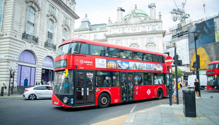 A red bus with the campaign banner regarding Pakistan's 75th Independence Day in London.  — Photo by the author