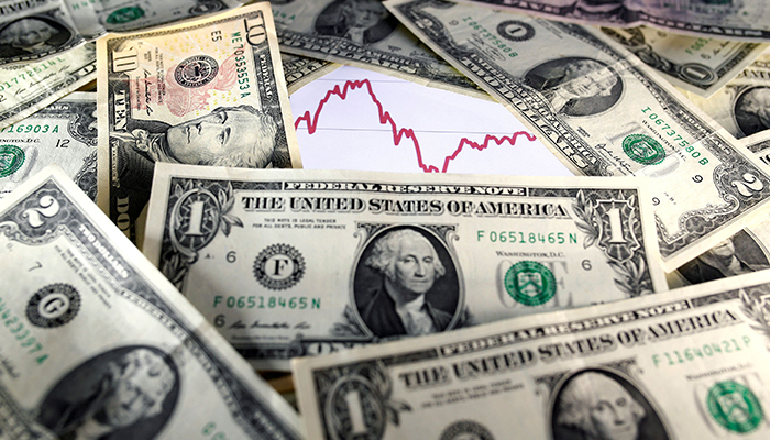 US dollar notes are seen in front of a stock graph in this November 7, 2016 picture illustration. — Reuters