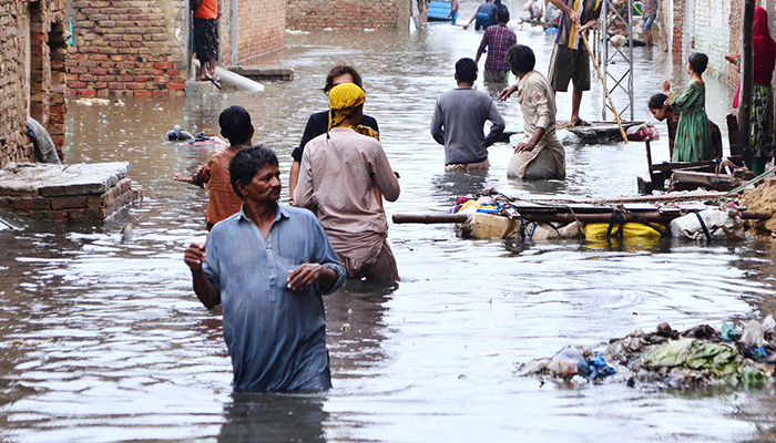 Rain affected people by flash floods after torrential rains hit Hyderabad, on August 2022. — APP