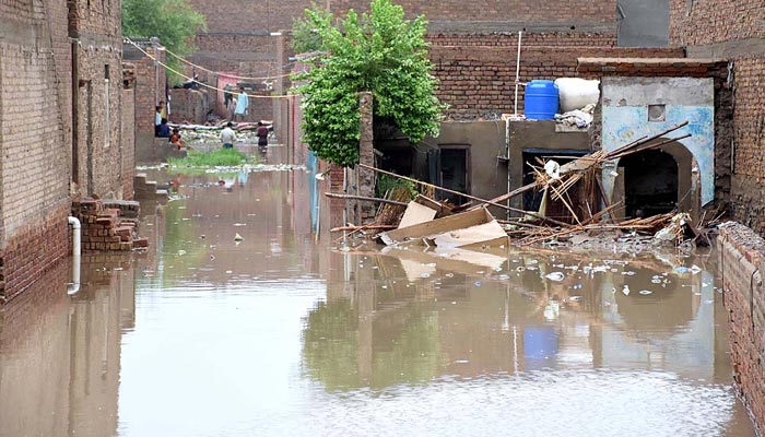 A view of damaged houses at New Nazar Colony after heavy rain in the Larkana. —