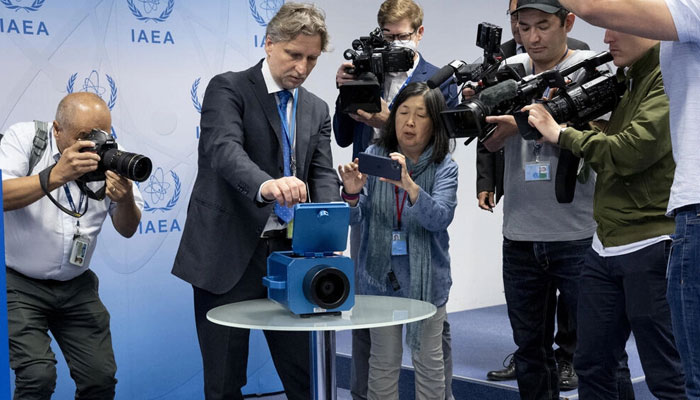 Media watch a demonstration of a monitoring camera used in Iran during a press conference of Rafael Grossi, director general of the International Atomic Energy Agency (IAEA), in June 2022. Photo: AFP/File