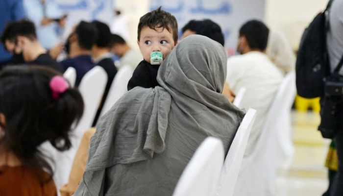 Evacuees from Afghanistan sit at Emirates Humanitarian City in Abu Dhabi, UAE, August 28, 2021.— Reuters